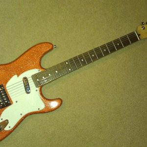 This is a kustom Paint Job using our metal flake guitar paint additive, Orange Copper Metal Flake.