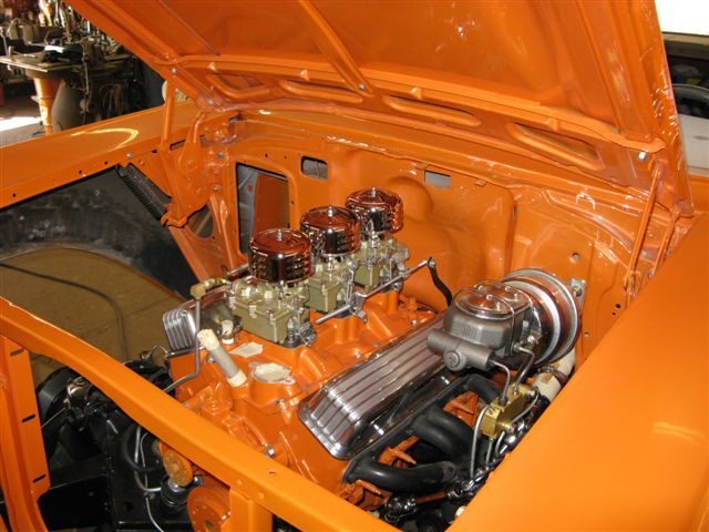 Engine compartment of 57 Chevy with the Gold Pearls and Flakes on the orange base.