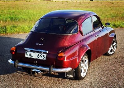 A Fire Red Flake Saab from SWEDEN.