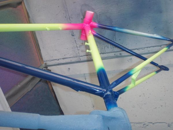 Several Neon Glow Pigments on a bike frame